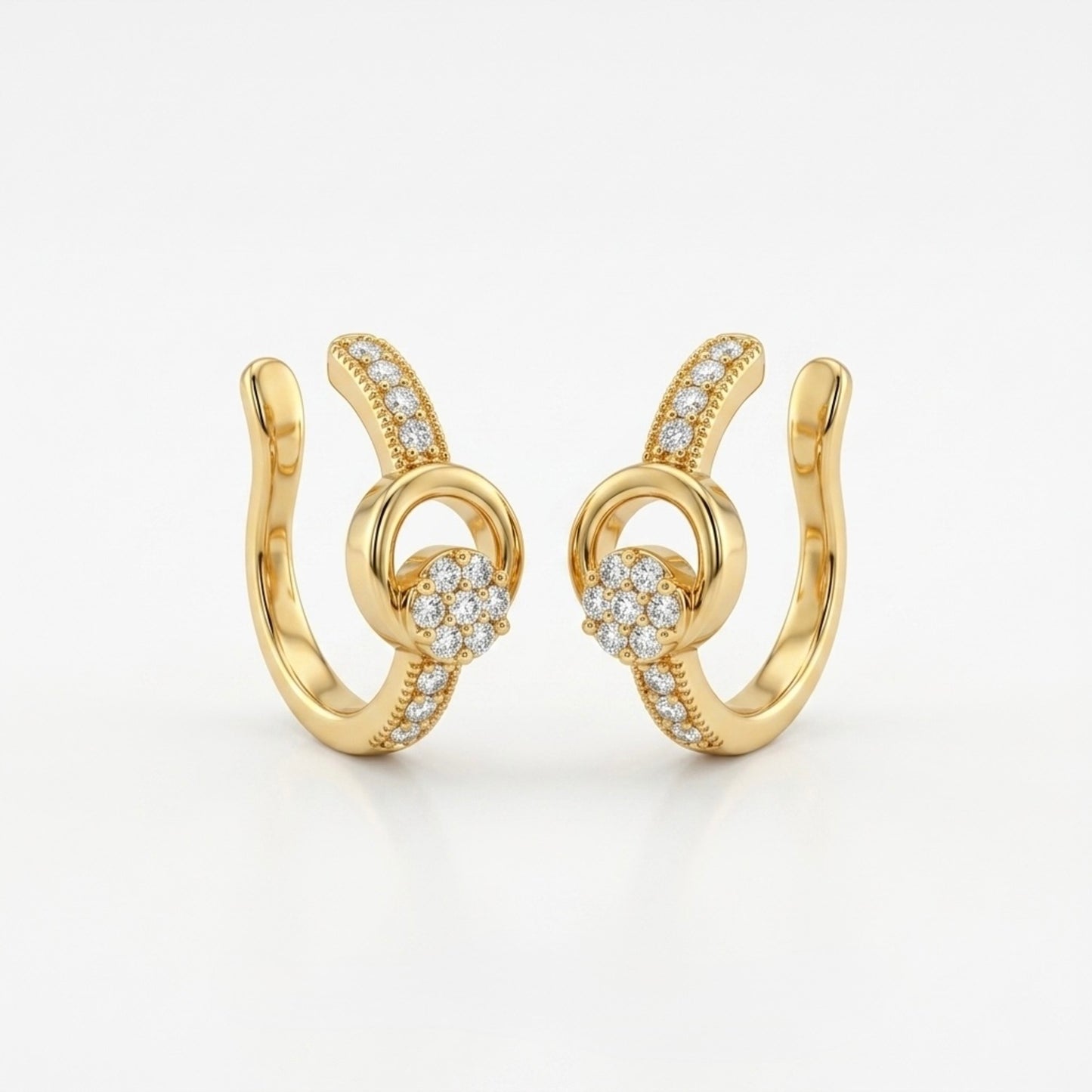 A pair of gold-plated ear cuffs for women featuring five brilliant-cut stones, shown on a white surface