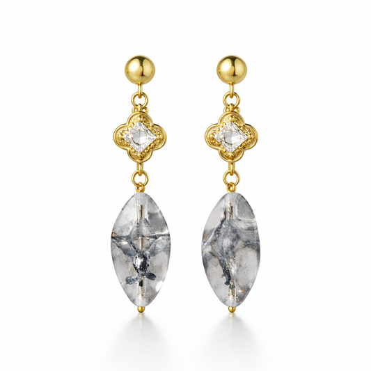 A pair of gold-plated long earrings for women featuring a princess-cut stone in a mandala setting and a large marquise-cut clear drop stone