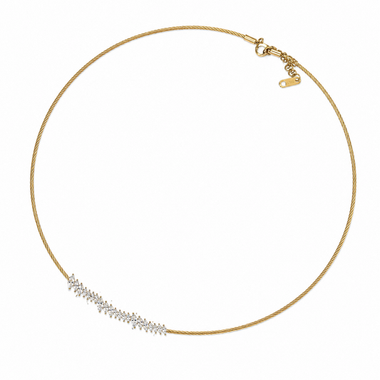 A gold-plated stainless steel chain for women featuring a twisted cable design and an asymmetrical cluster of marquise-cut crystals