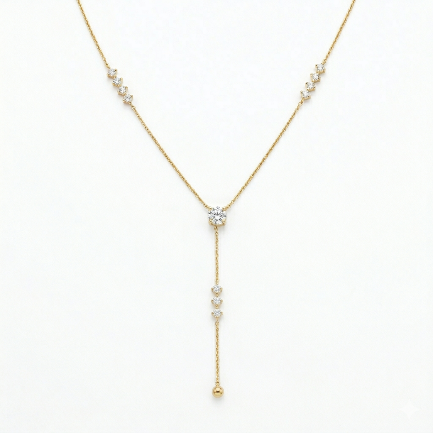 A gold-plated stainless steel chain for women featuring a Y-drop design with multiple crystal accents and a gold bead finish
