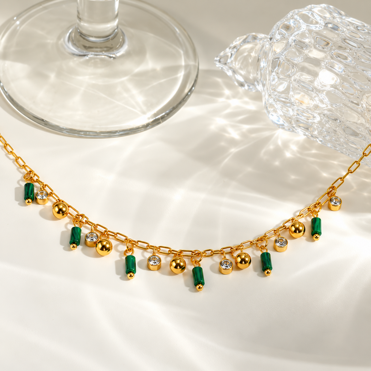 Green Charm Necklace with green cylindrical charms, clear crystal accents and gold-tone ball charms.