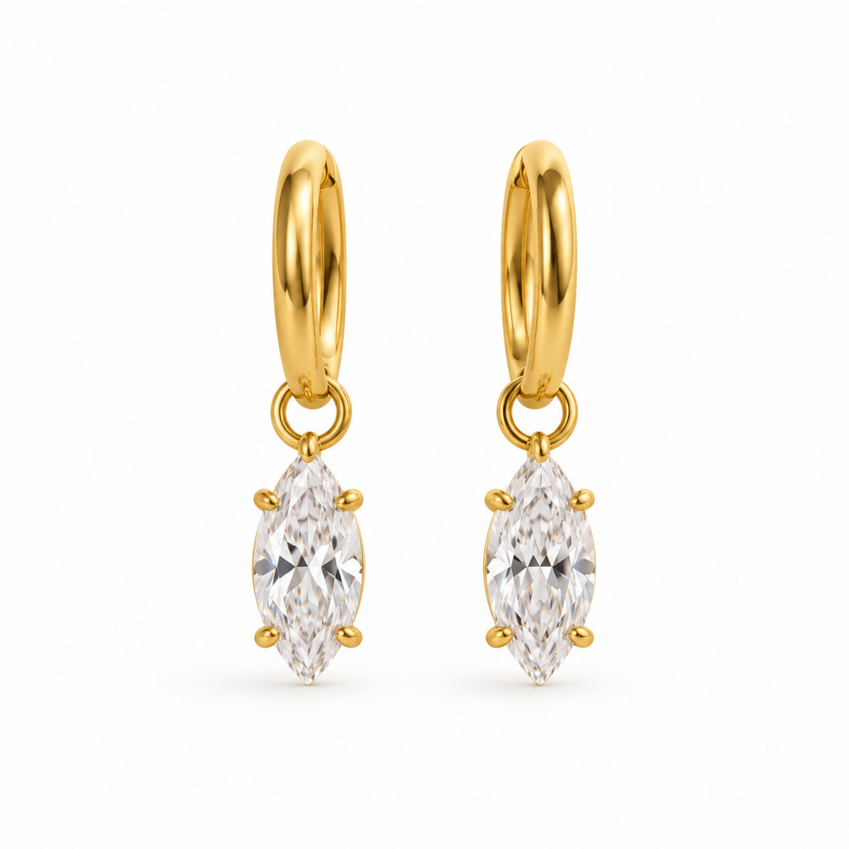 A pair of gold hoop earrings with marquise-cut clear gemstones, shown on a plain white background.