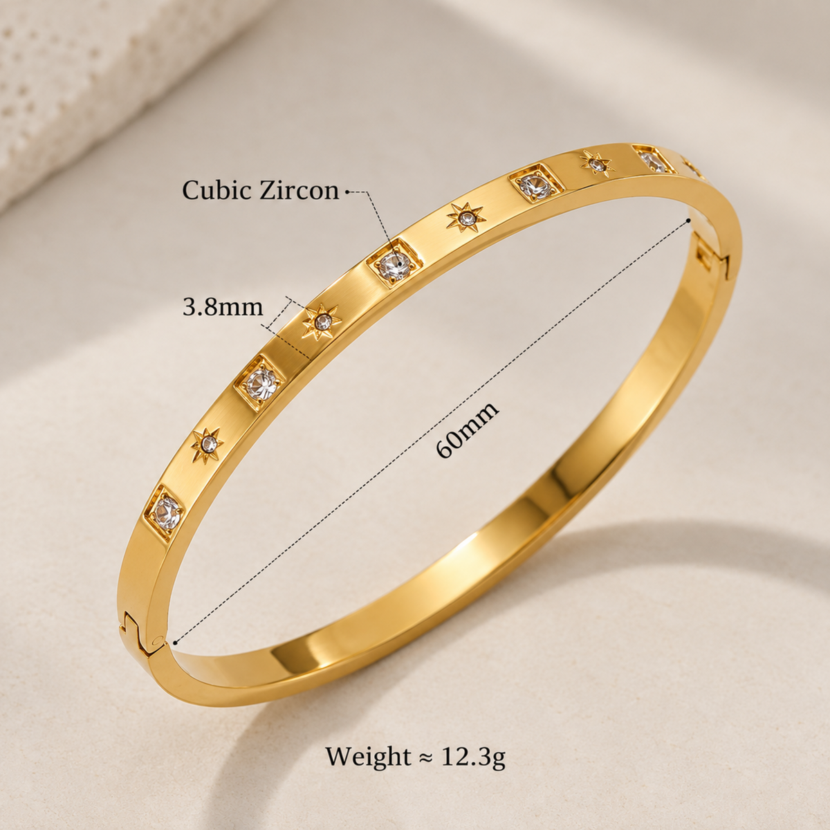 Gold crystal bangle for women with starburst and geometric crystal details and 18kt gold plated finish