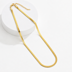 A gold-plated stainless steel chain for women featuring a high-shine, liquid-like flat snake chain layout.