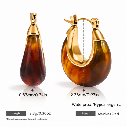Amber resin hoop earrings for women with 18K gold plated accents, chunky rounded design and glossy finish