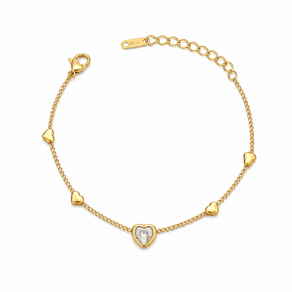 A gold-plated ladies bracelet featuring a central crystal heart and four small polished gold heart accents on a fine chain.