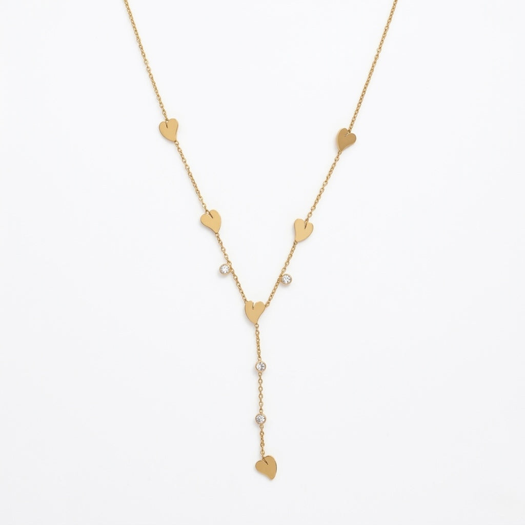 A gold-plated stainless steel Y-shaped chain necklace for women featuring minimalist heart charms and small round crystals, shown against a white background.