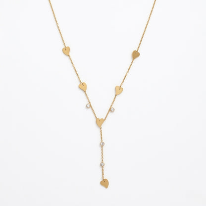 A gold-plated stainless steel Y-shaped chain necklace for women featuring minimalist heart charms and small round crystals, shown against a white background.