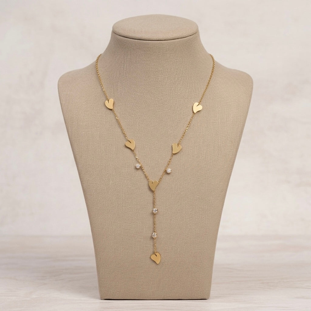 A gold-plated stainless steel Y-shaped chain necklace for women featuring minimalist heart charms and small round crystals