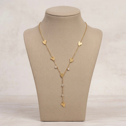 A gold-plated stainless steel Y-shaped chain necklace for women featuring minimalist heart charms and small round crystals