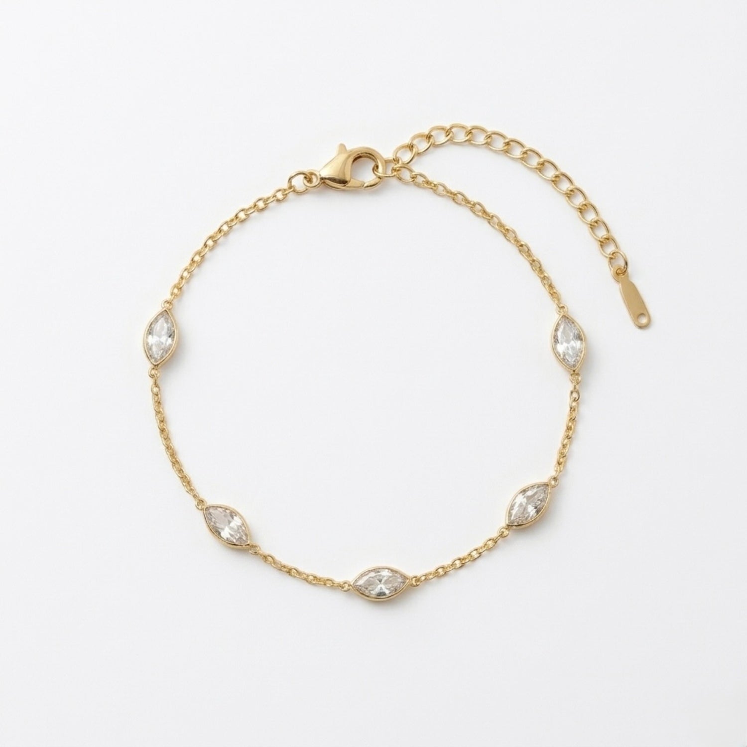 A dainty gold-plated chain bracelet for women featuring clear marquise-cut stone stations, shown on a clear white background