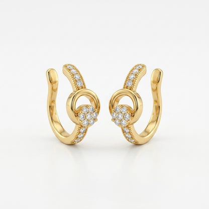 A pair of gold-plated ear cuffs for women featuring five brilliant-cut stones, shown on a white surface