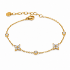 A gold-plated chain bracelet for women featuring alternating crystal floral clusters and round bezel-set stones.