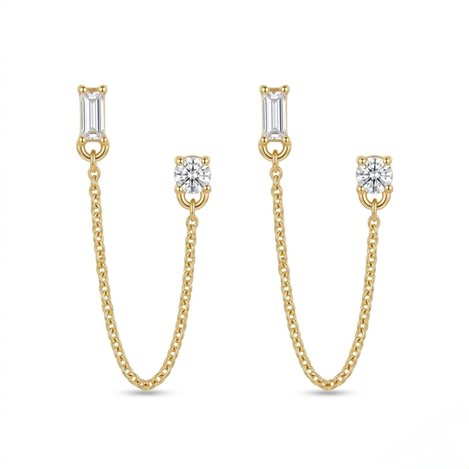 A pair of gold-plated ear chain earrings for women featuring a single baguette-cut white stone stud and a round solitaire stud connected by a fine gold chain on a white background