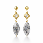 A pair of gold-plated long earrings for women featuring a princess-cut stone in a mandala setting and a large marquise-cut clear drop stone