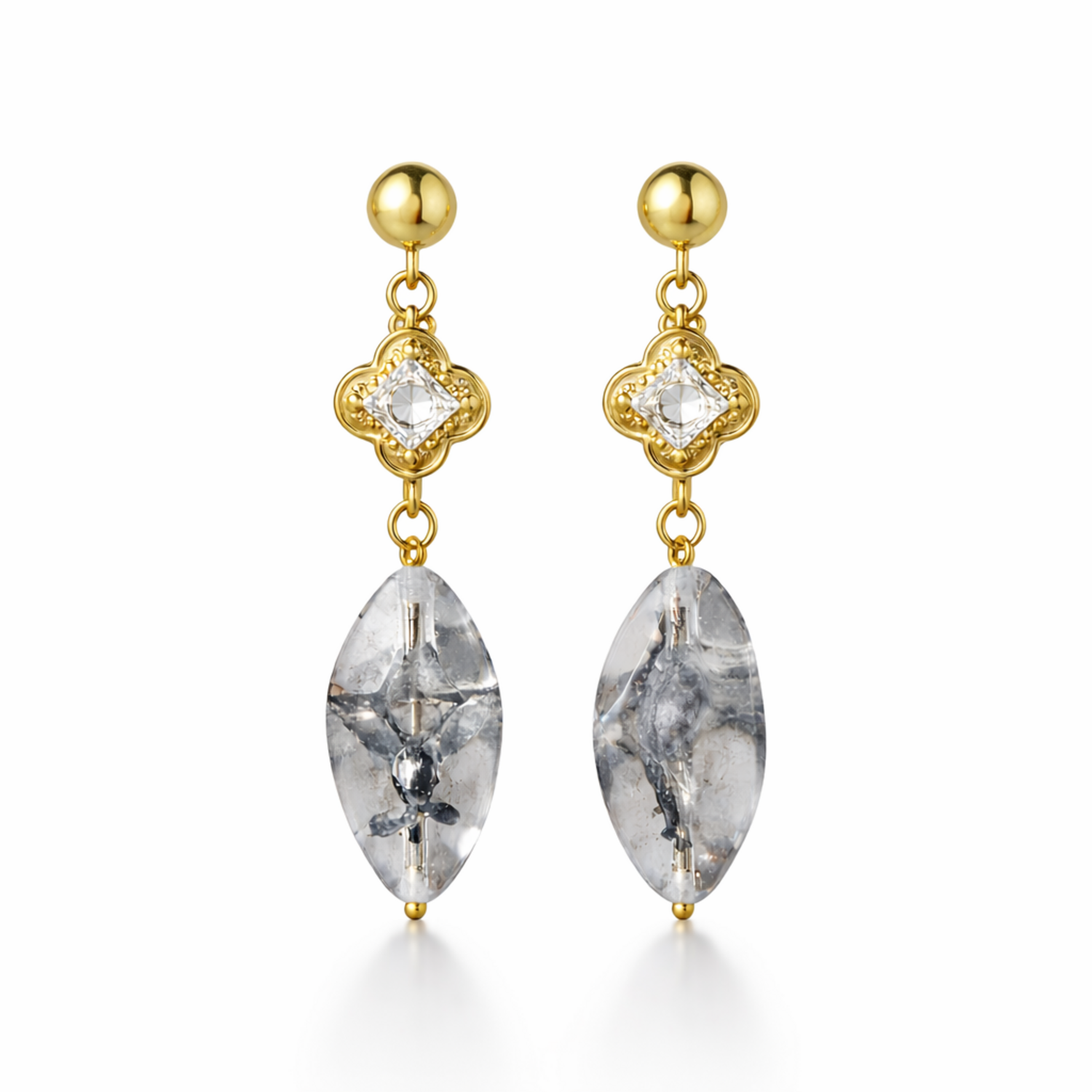 A pair of gold-plated long earrings for women featuring a princess-cut stone in a mandala setting and a large marquise-cut clear drop stone