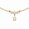 A close-view of a delicate gold-plated ladies bracelet featuring a cluster of four brilliant-cut crystals and a dangling drop stone.