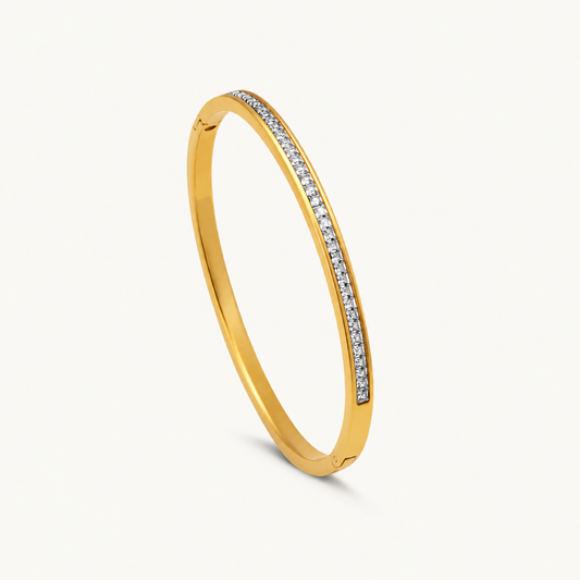 Crystal Bangle Bracelet with clear square-cut crystals set along a polished gold-plated band.