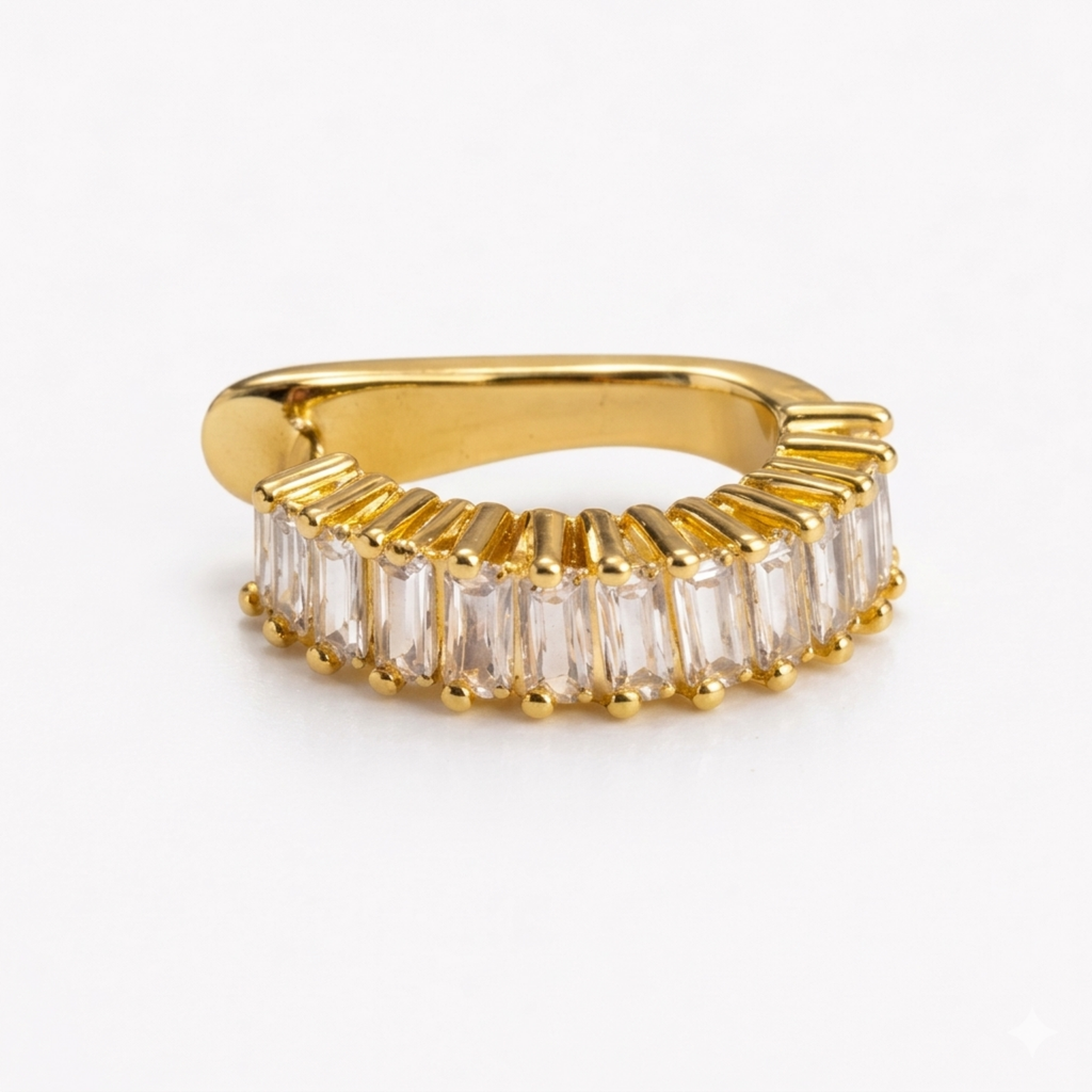 A gold-plated ear cuff for women featuring brilliant prong-set baguette-cut white stones, shown in close-up on a white background