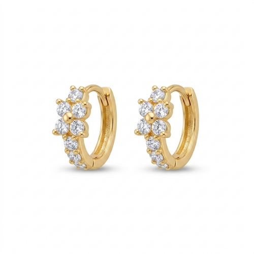 A pair of gold-plated huggie hoop earrings for women featuring a small clear crystal flower design, on a white background