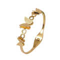 A gold-plated cuff bangle for women featuring three frosted-finish butterfly charms and polished circular links.