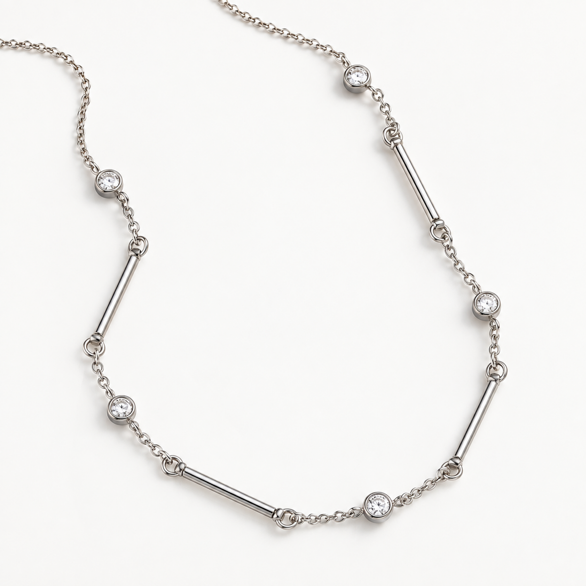 A close-view of a Silver crystal bar necklace for women with delicate chain, polished bar details and sparkling round crystal accents