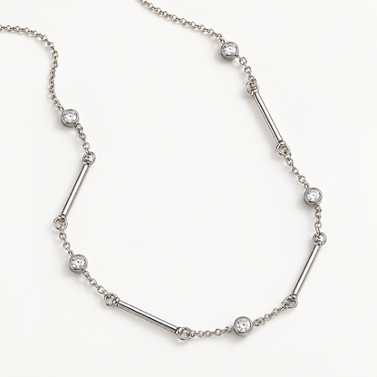 A close-view of a Silver crystal bar necklace for women with delicate chain, polished bar details and sparkling round crystal accents