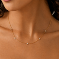 A close-view of a gold-plated stainless steel chain for women featuring multiple small crystal-encrusted star stations