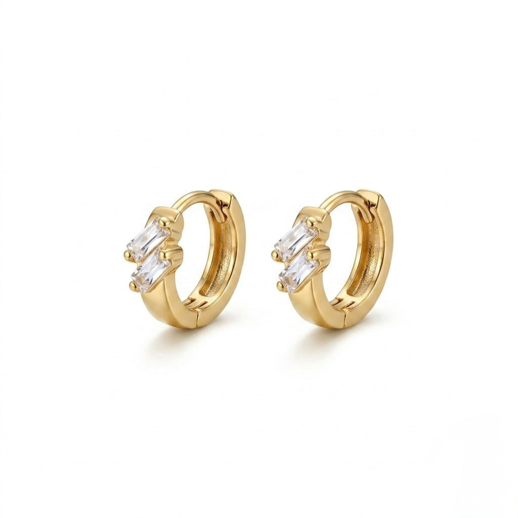 A pair of gold-plated double-row crystal huggie hoop earrings for women shown on a clean white background.