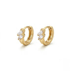 A pair of gold-plated double-row crystal huggie hoop earrings for women shown on a clean white background.