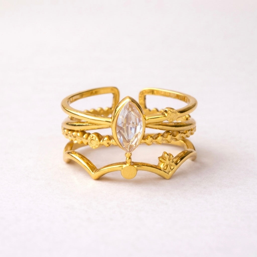 A triple-layered gold plated adjustable ring band for women on a white background