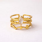 A triple-layered gold plated adjustable ring band for women on a white background