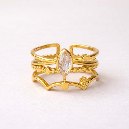 A triple-layered gold plated adjustable ring band for women on a white background