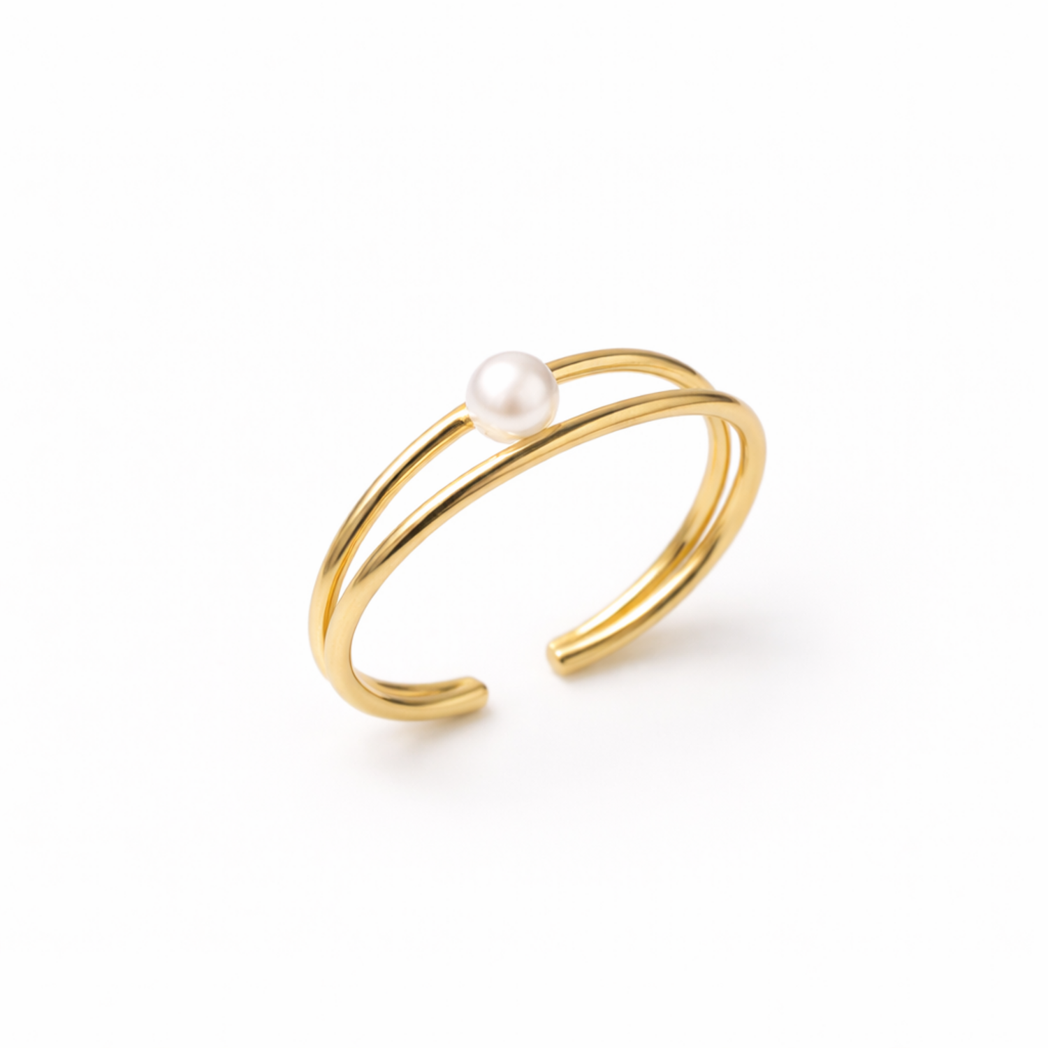 A close view of a modern gold-plated double-band adjustable cuff bracelet for women featuring a single central pearl