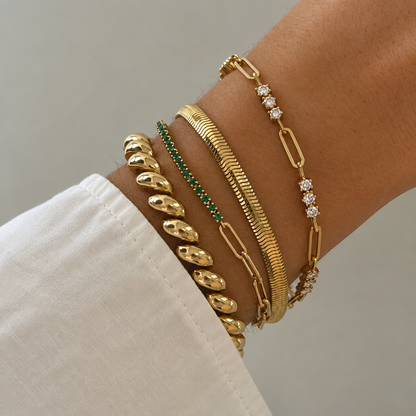 Clara Crystal Link Bracelet with sparkling clear crystal accents in gold, on a model