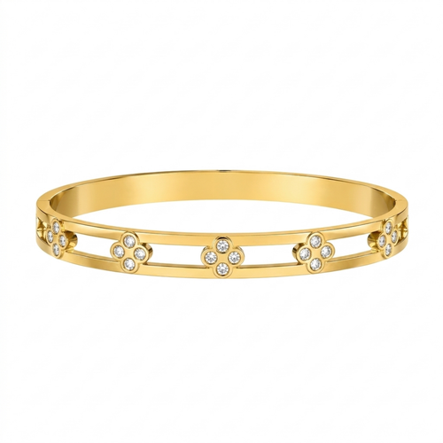 A gold-plated dual-band cuff bangle for women featuring four-petal clover crystal motifs and a secure side-hinge clasp.