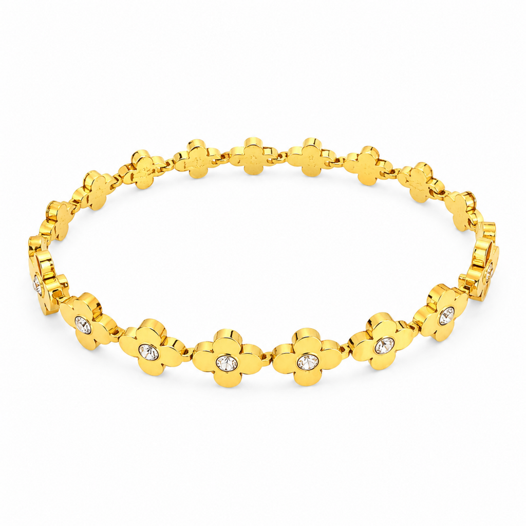 A gold-plated link bangle for women featuring a continuous row of clover motifs with crystal centers and a secure clasp.