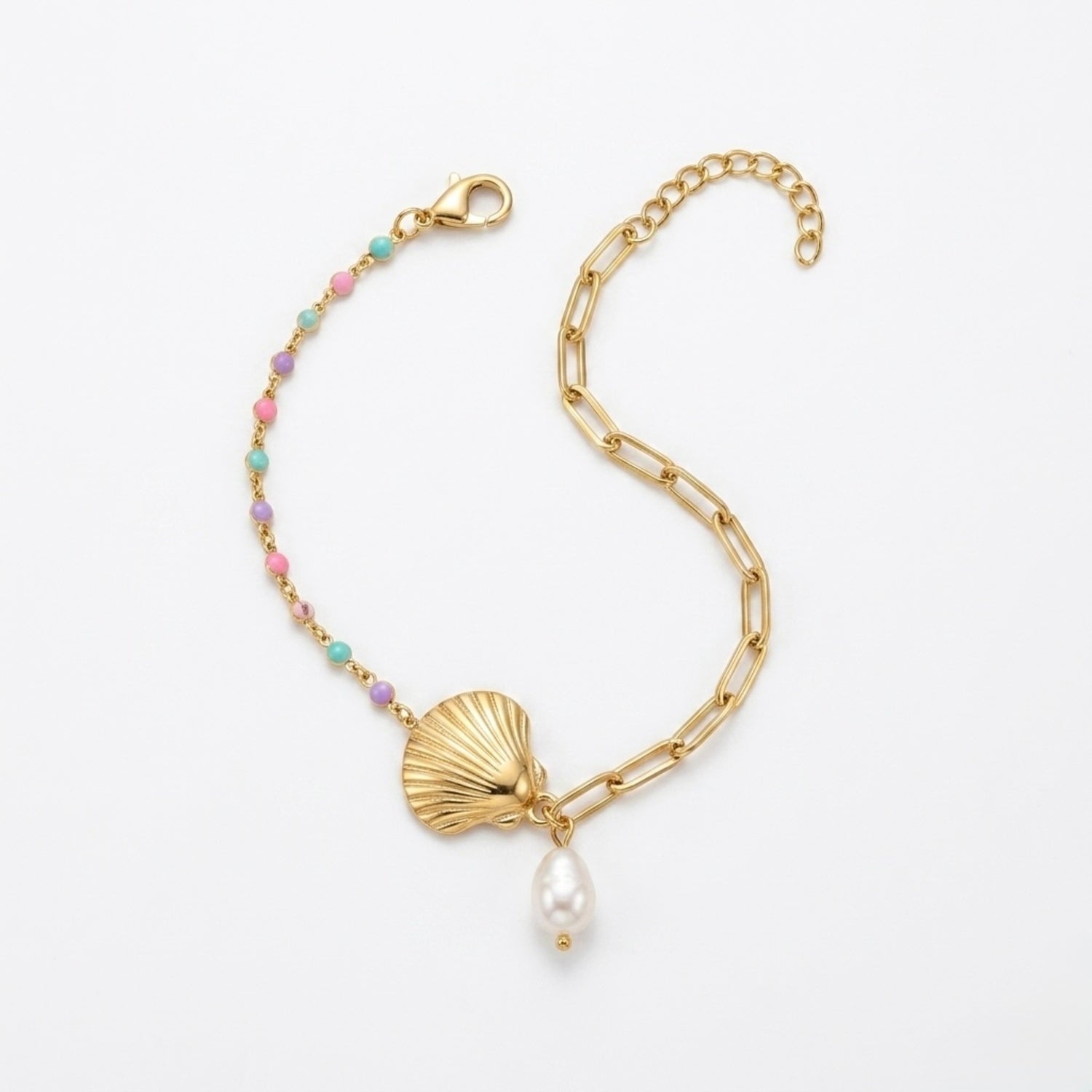 A gold-plated ladies bracelet featuring a gold paperclip chain on one side and a colorful beaded pearl strand with a shell charm on the other.