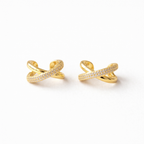 A pair of gold-plated criss-cross double-band ear cuff earrings for women featuring interlinked smooth and pavé crystal bands on a white background