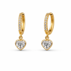A pair of gold-plated hoop earrings for women featuring a suspended heart-shaped clear crystal drop, shown on a clean white background.