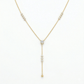 A gold-plated stainless steel chain for women featuring a Y-drop design with multiple crystal accents and a gold bead finish