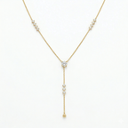 A gold-plated stainless steel chain for women featuring a Y-drop design with multiple crystal accents and a gold bead finish