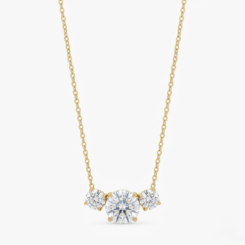 A gold-plated stainless steel chain for women featuring three graduated round-cut crystal stones.