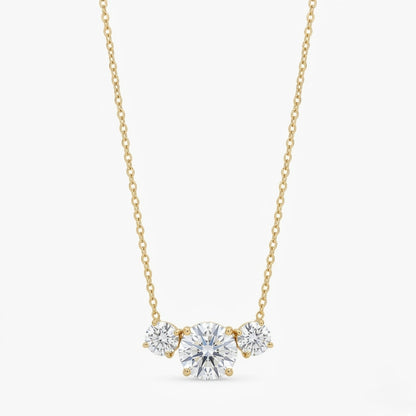 A gold-plated stainless steel chain for women featuring three graduated round-cut crystal stones.