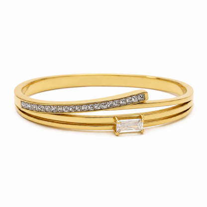 A layered gold-plated bracelet for women featuring a triple-band design with pavé crystals and a central baguette stone.