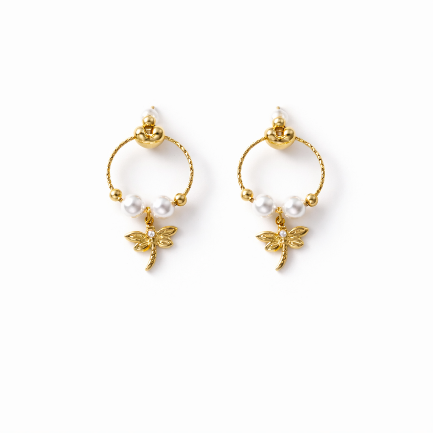 A pair of gold-plated earrings for women featuring a detailed dragonfly charm and three white pearls, shown on a white background.