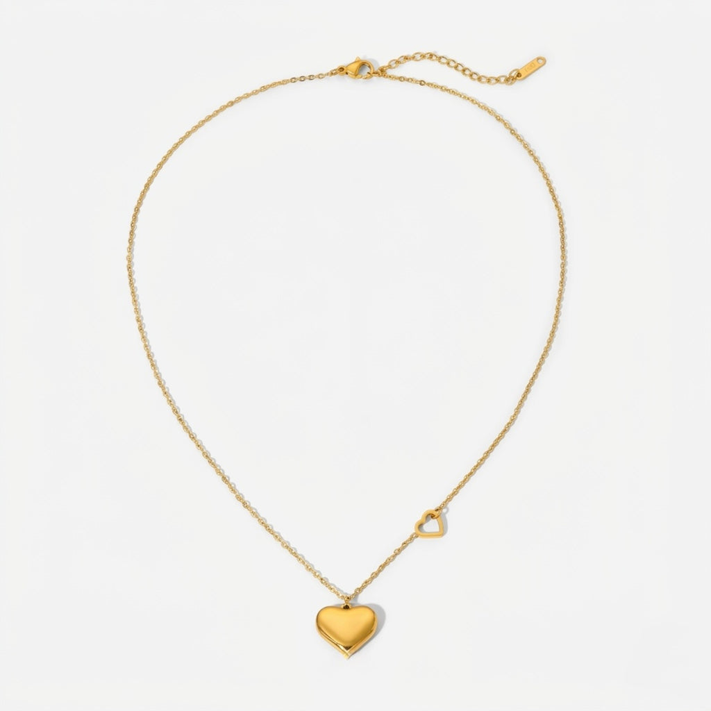 A gold-plated stainless steel chain for women featuring a polished 3D heart pendant and a smaller open-heart charm integrated into the side of the chain