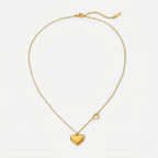 A gold-plated stainless steel chain for women featuring a polished 3D heart pendant and a smaller open-heart charm integrated into the side of the chain
