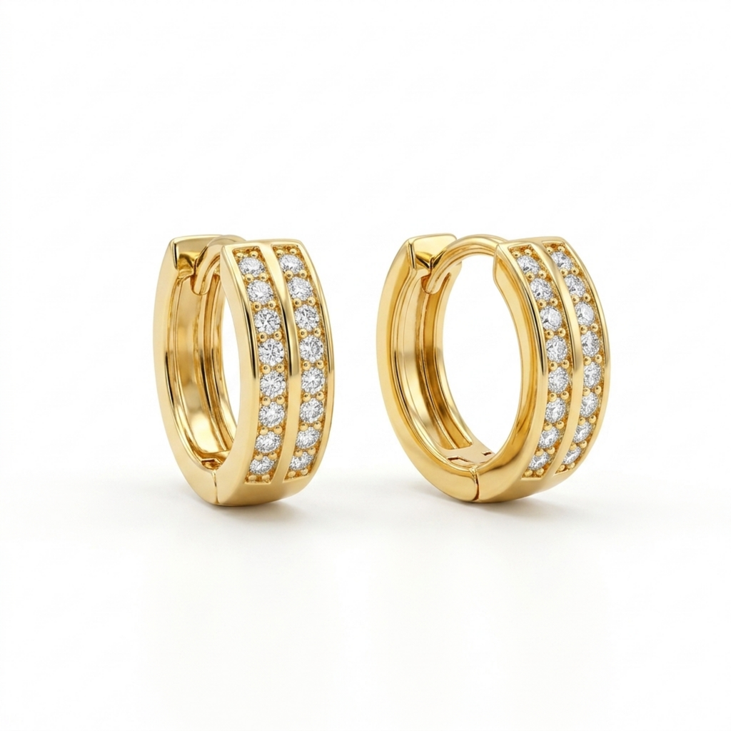 A pair of gold-plated huggie hoop earrings for women featuring a duo design set with clear crystals, shown on a clean white background.