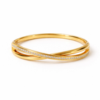 A luxurious gold-plated double-band cross-over bangle for women featuring one polished strand and one strand of brilliant pavé white stones displayed on a white background